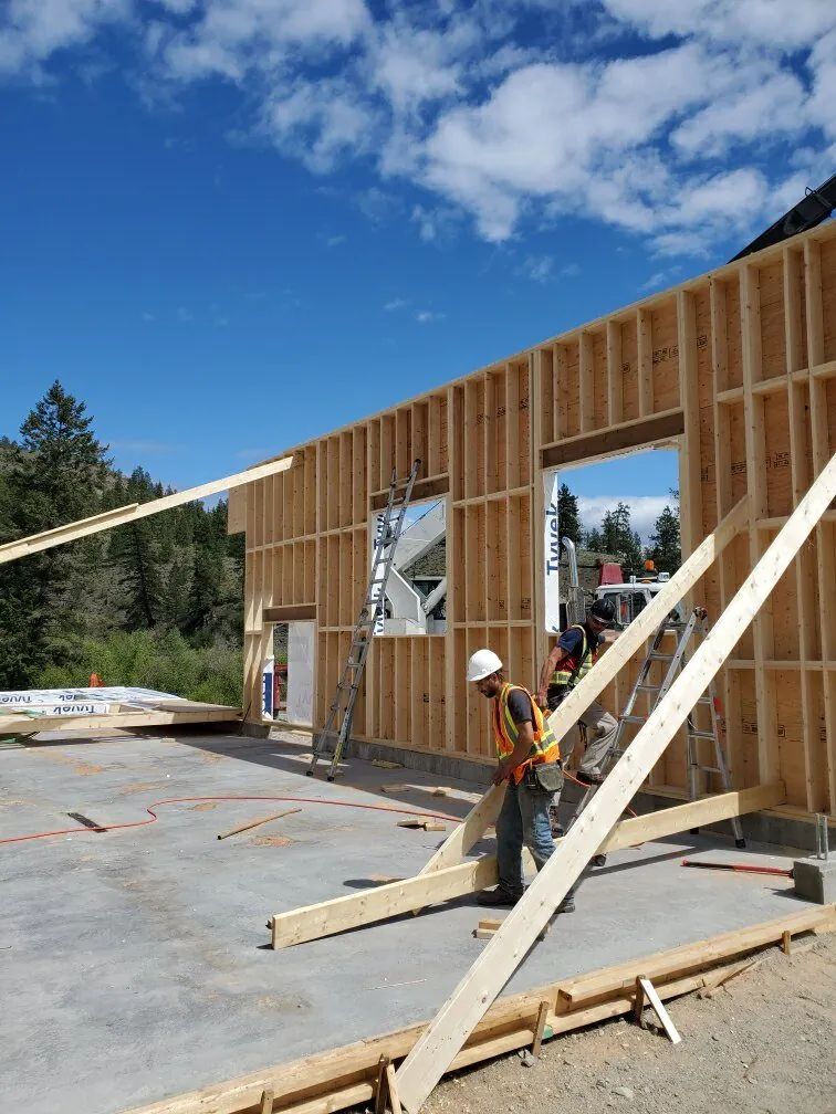 Comark crew raising a framed wall